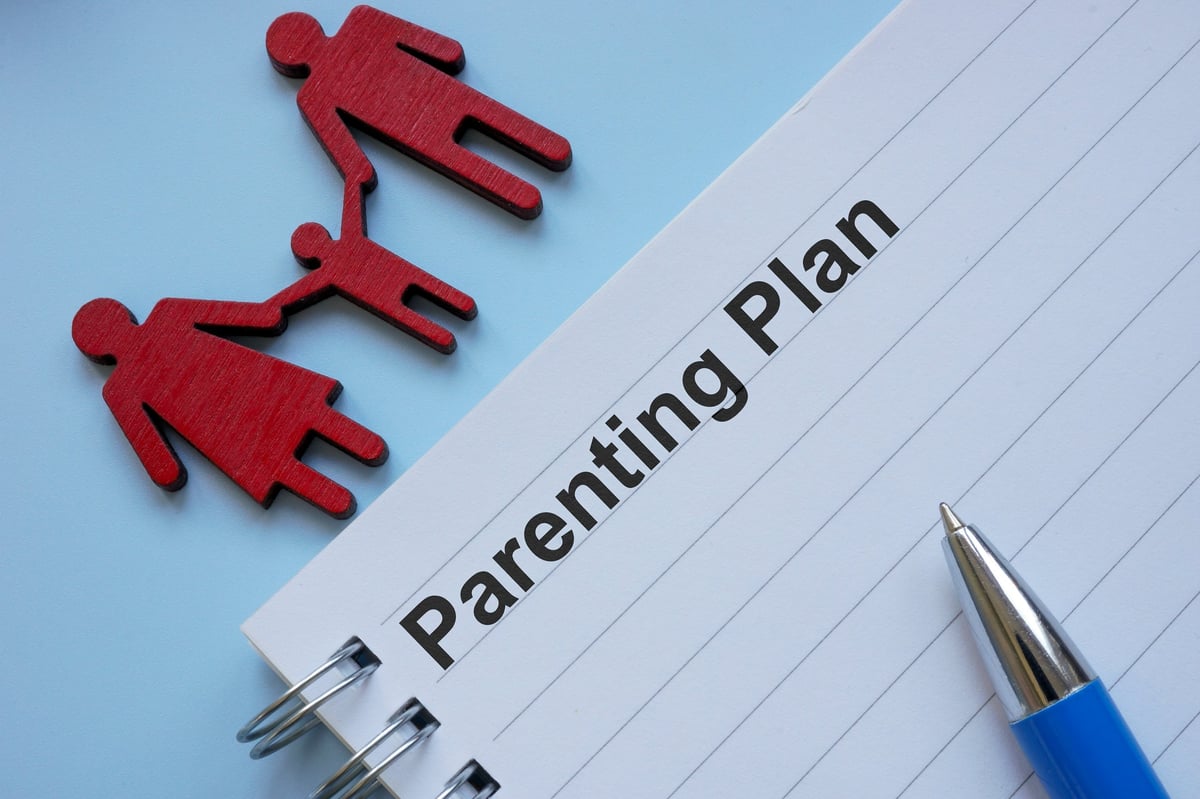Parenting plan on the table symbolizing co-parenting strategies